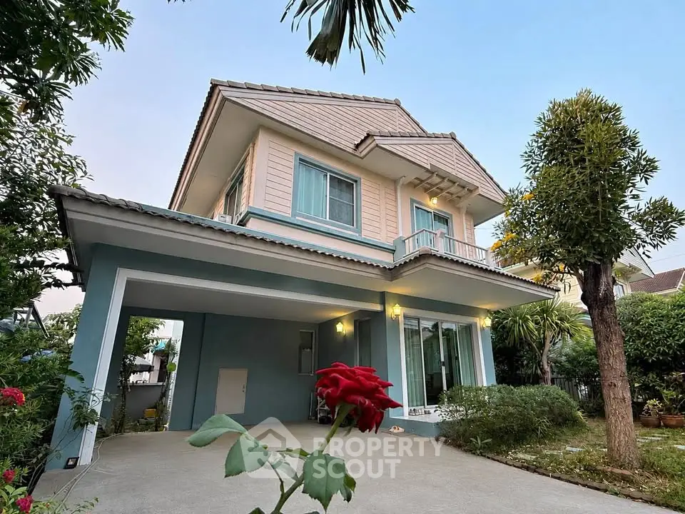 Charming two-story house with lush garden and spacious driveway, perfect for family living.