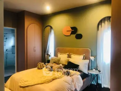 Cozy bedroom with plush bedding and modern decor