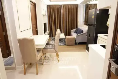 Modern open-plan living and dining area with elegant furniture and natural light.