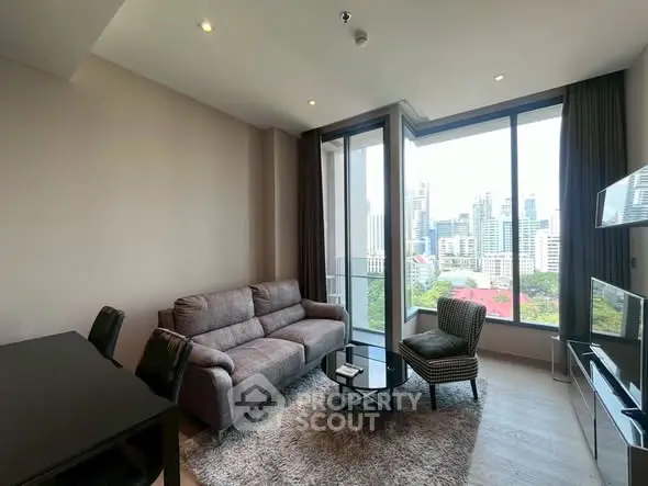 Modern living room with city view, featuring cozy sofa and stylish decor.