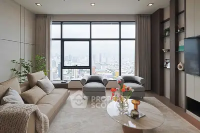 Luxurious living room with panoramic city view and elegant modern decor.