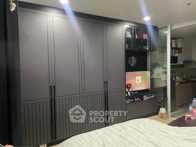 Modern bedroom with sleek built-in wardrobe and cozy ambiance