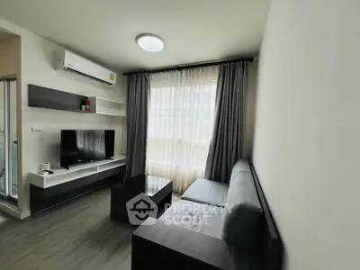 Modern living room with sleek furniture and natural light, perfect for urban living.
