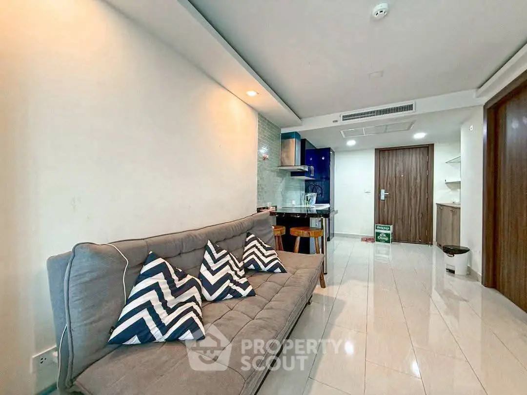 Modern living room with stylish decor and open kitchen layout