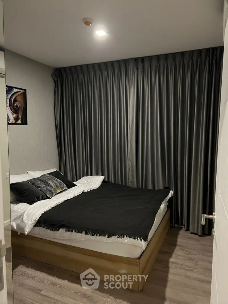 Cozy bedroom with elegant dark curtains and modern decor