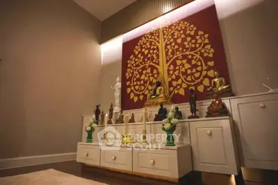 Elegant interior with spiritual decor and artistic wall feature