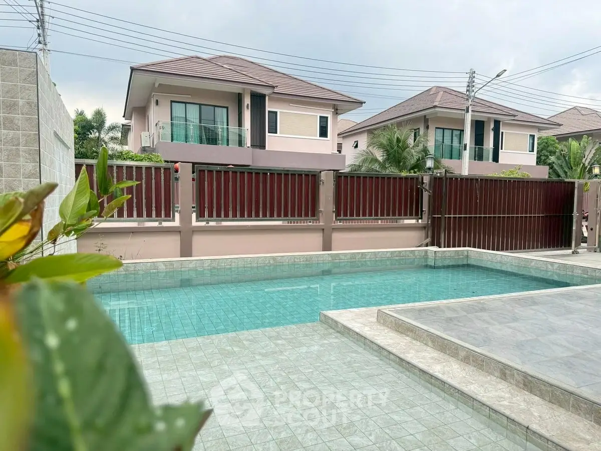 Luxurious residential property with private pool and modern architecture in serene neighborhood.