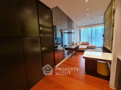 Modern open-layout living room with sleek design and large windows