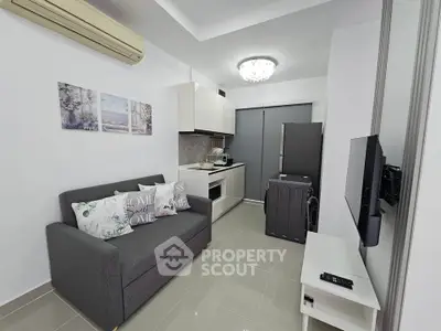 Modern compact living room with sleek kitchen and stylish decor