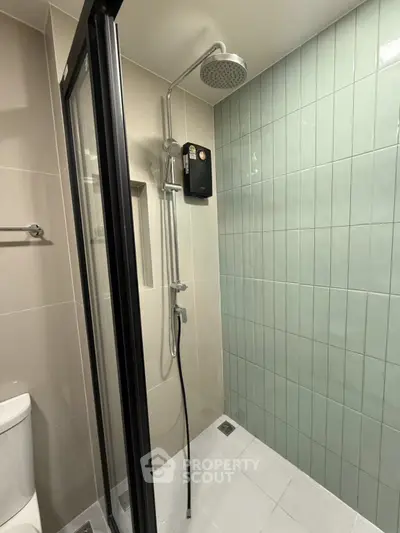 Modern bathroom with sleek shower enclosure and stylish tiles