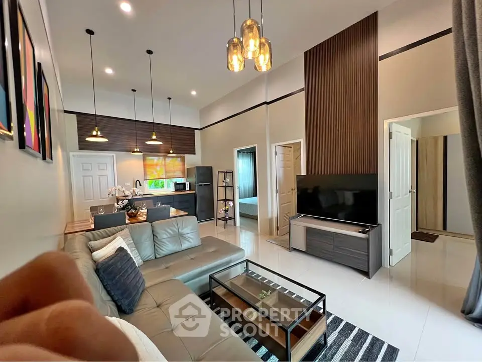 Modern living room with stylish decor, open layout, and cozy ambiance, perfect for relaxation and entertainment.