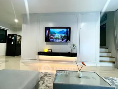 Modern living room with sleek TV setup and stylish decor