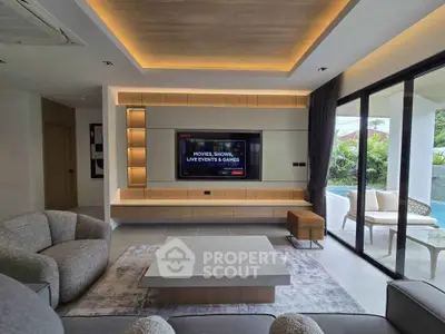 Luxurious living room with modern design, large TV, and pool view, perfect for entertainment and relaxation.
