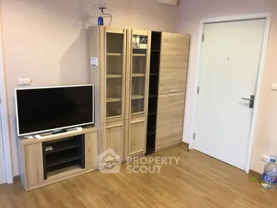 Modern living room with wooden floor and sleek TV cabinet