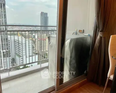 Modern apartment balcony with city view and washing machine setup.