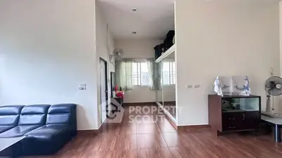Spacious living room with modern furniture and large windows for natural light.