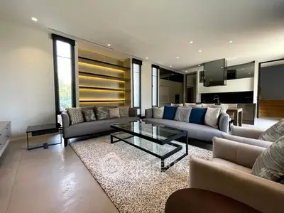 Luxurious modern living room with open kitchen and stylish furnishings