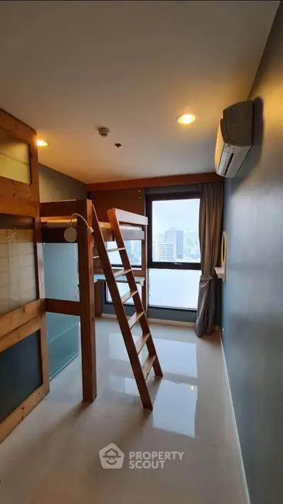 Modern loft-style bedroom with city view and wooden ladder access.