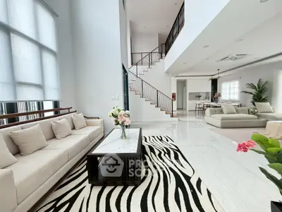 Spacious modern living room with high ceilings and elegant decor