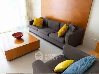 Modern living room with stylish furniture and vibrant cushions