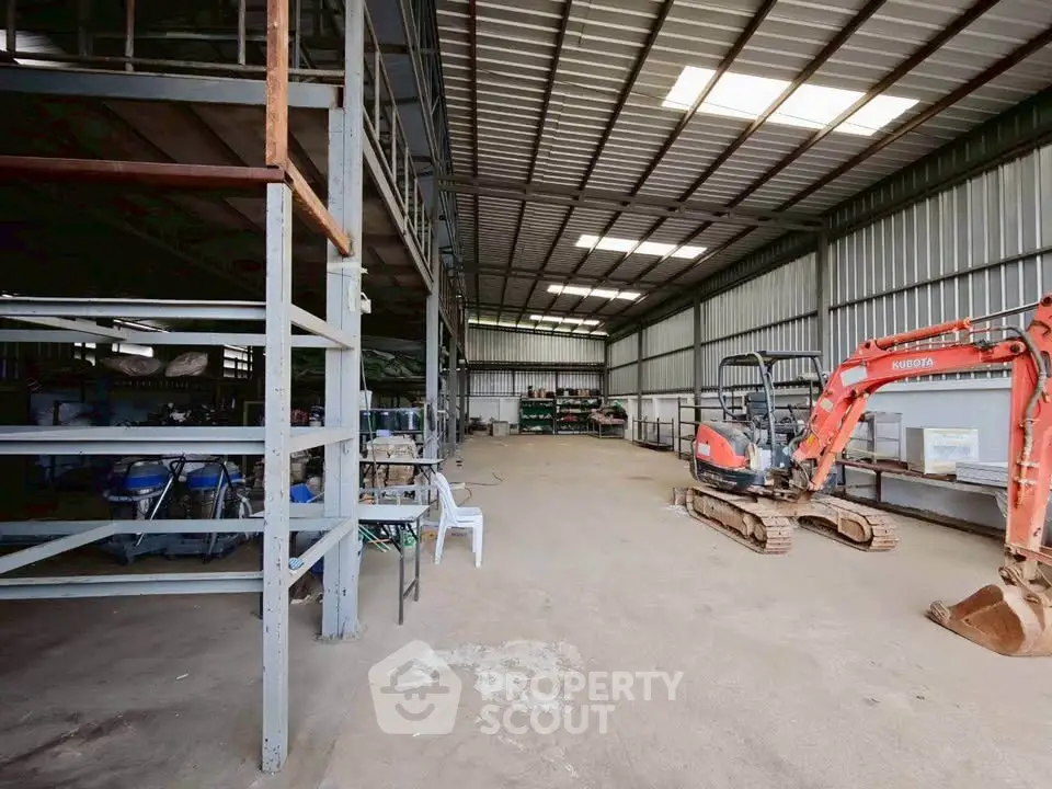 Spacious industrial warehouse with high ceilings and ample storage space.