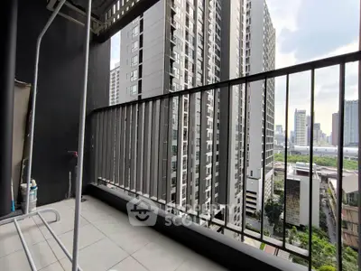 Spacious balcony with city skyline view in modern high-rise building