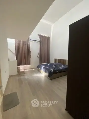 Spacious bedroom with modern design and natural light