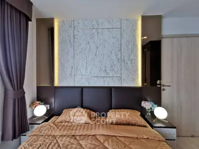 Luxurious bedroom with elegant marble accent wall and modern lighting