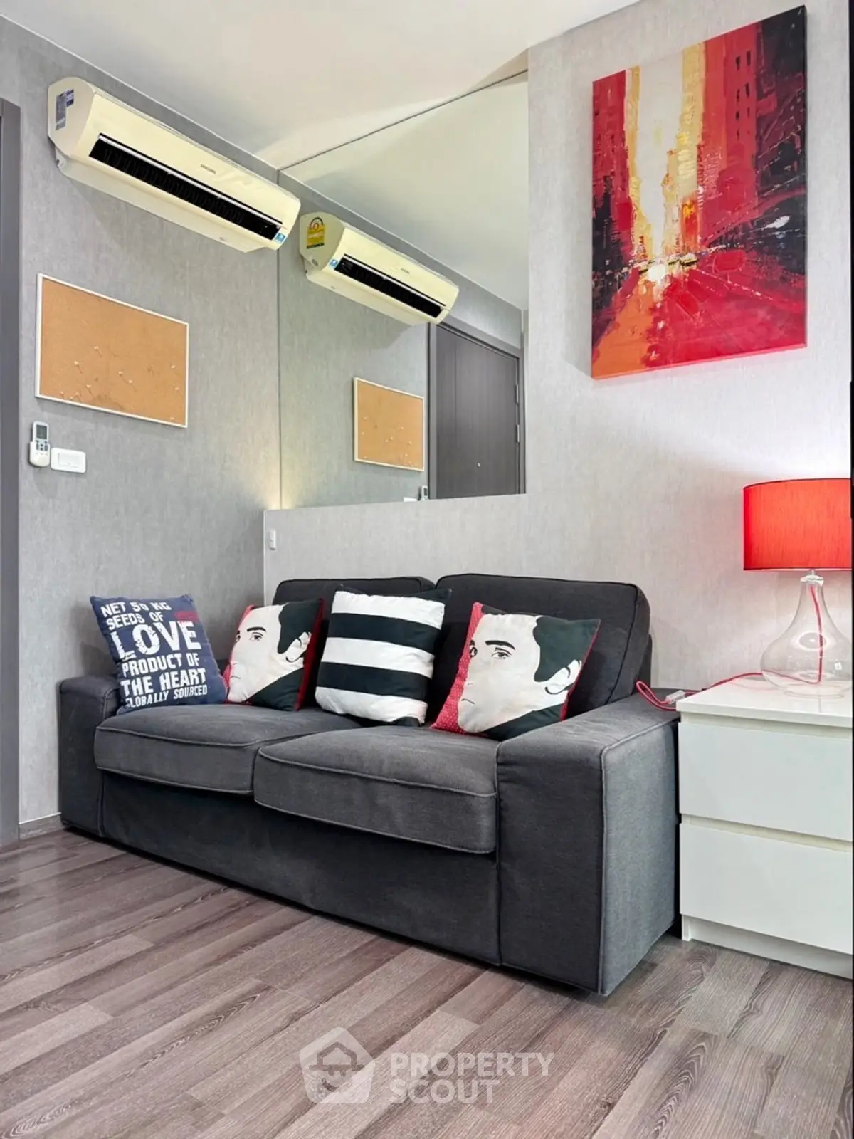 Stylish living room with modern decor and cozy sofa in urban apartment.