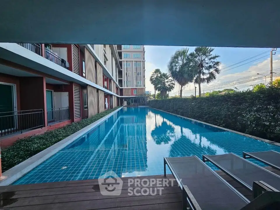 Luxurious condominium with stunning poolside view and modern amenities.