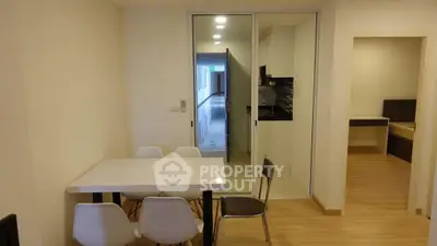 Modern apartment interior with dining area and open kitchen layout