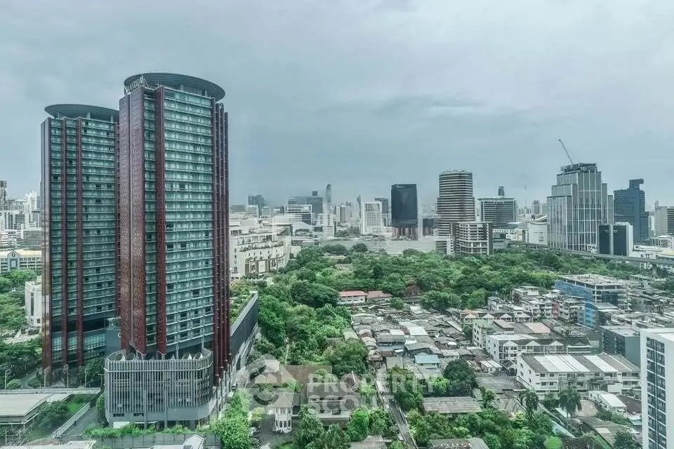 Stunning cityscape view with modern high-rise buildings and lush greenery, perfect for urban living enthusiasts.