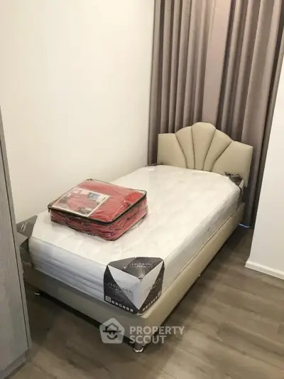 Cozy bedroom with elegant bed and modern decor, perfect for restful nights.