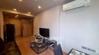 Modern living room with sleek furniture and air conditioning in a stylish apartment.