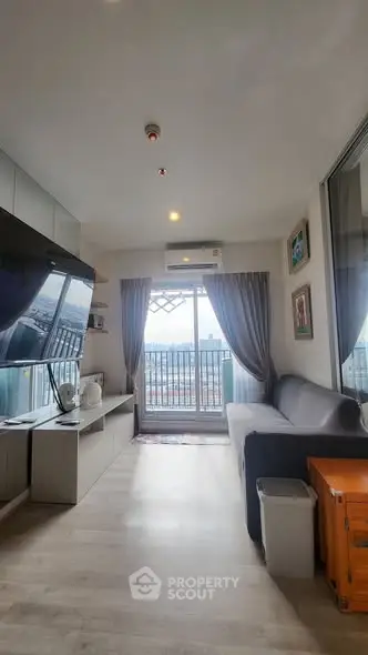 Modern living room with balcony view and sleek furnishings