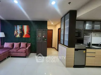 Modern living room with stylish decor and open kitchen layout
