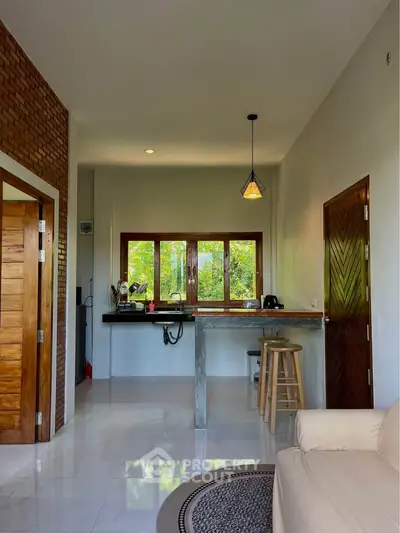 Charming open-layout kitchen with natural light and modern design