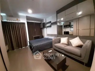 Modern bedroom with stylish decor and cozy seating area