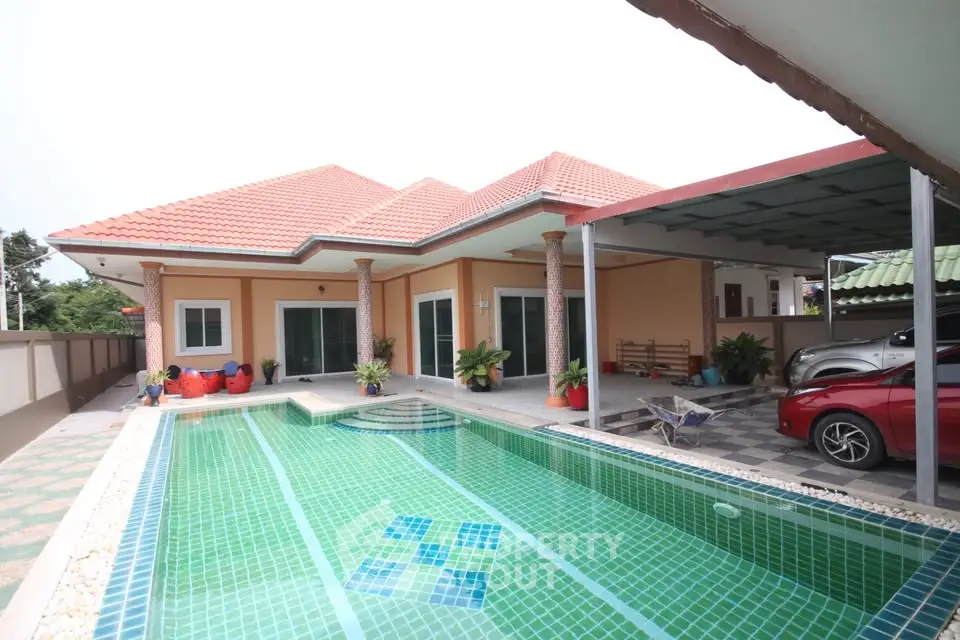 Stunning villa with private pool and spacious carport, perfect for luxury living.