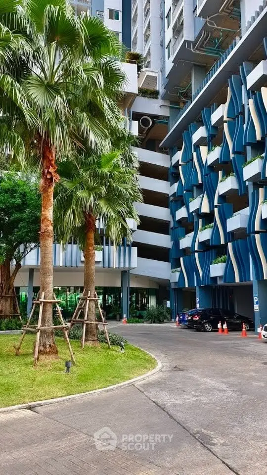 Modern architectural building with unique facade and lush landscaping