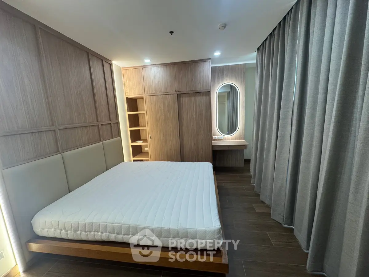 Modern bedroom with wooden accents and built-in wardrobe
