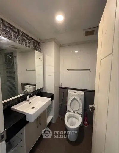 Modern bathroom with sleek fixtures and stylish tile accents