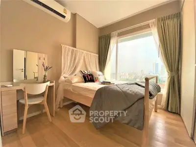 Bright and cozy bedroom with city view, featuring modern decor and natural light.