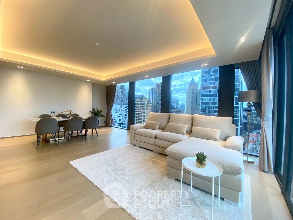 Luxurious living room with city view, spacious seating, and elegant dining area.