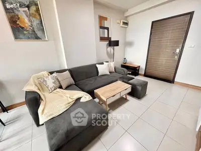 Modern living room with stylish gray sofa and contemporary decor