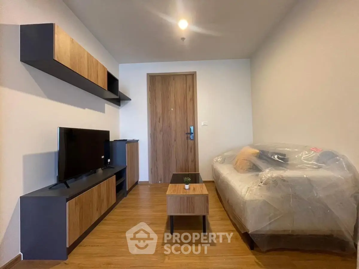 Modern living room with sleek furniture and wooden flooring