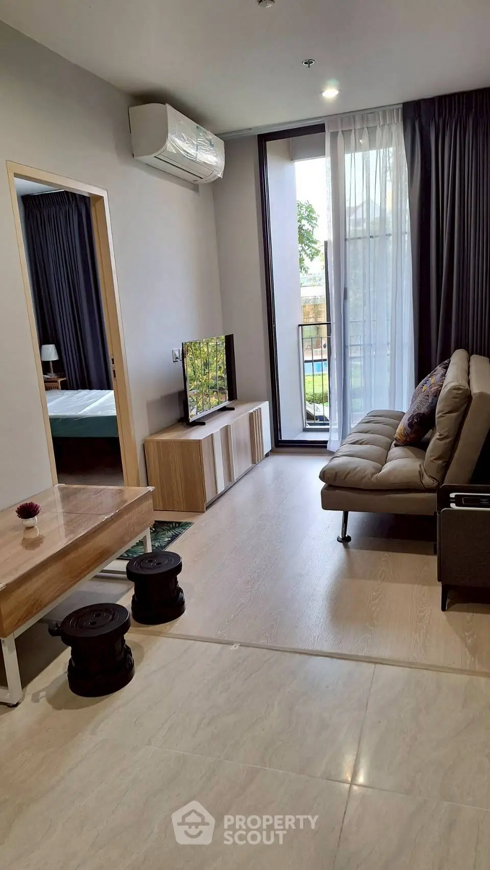 Modern living room with balcony access and stylish decor