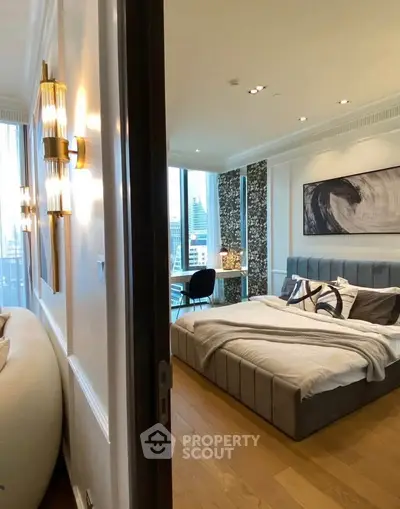 Luxurious modern bedroom with city view, elegant decor, and cozy ambiance