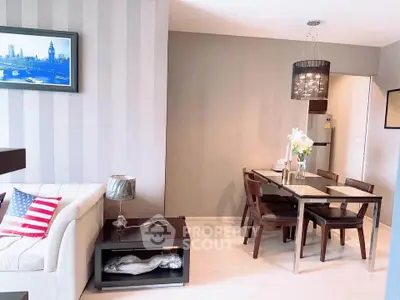 Modern living room with dining area, stylish decor, and cozy ambiance in a contemporary apartment.