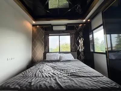 Luxurious bedroom with modern design and large window view